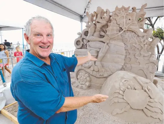  ?? Picture: RICHARD GOSLING ?? Kevin Crawford took out the Australian Sand Sculpting Championsh­ip with his intricate Seahorse Races at Surfers Paradise yesterday.