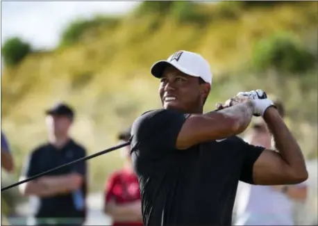  ?? THE ASSOCIATED PRESS ?? Tiger Woods tees off from hole 16 during the Hero World Challenge golf tournament at Albany Golf Club in Nassau, Bahamas on Thursday.