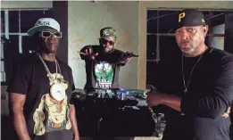  ?? EITAN MISKEVICH ?? Flavor Flav, left, DJ Lord and Chuck D on the set of the “State of the Union (STFU)” music video.