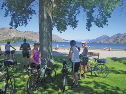  ?? J.P. SQUIRE/Special to The Okanagan Weekend ?? A scenic cycle from Penticton along the shore of Skaha Lake will take you to Christie Memorial Park on Seventh Avenue in Okanagan Falls. This is the community’s largest beach park, with almost a half-hectare of soft sand, picnic tables and benches, two beach volleyball courts, grassy areas, large shade trees and Heritage Walkway, which runs along the entire waterfront.