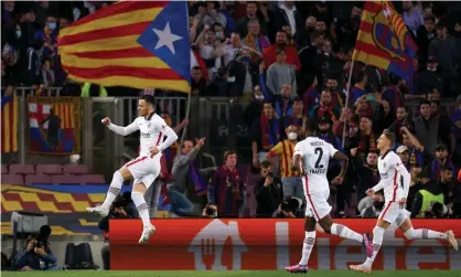  ?? Photograph: Quality Sport Images/Getty Images ?? Filip Kostic leaps with joy after opening the scoring from the spot at Camp Nou – he later added Eintracht Frankfurt’s third goal.