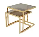  ??  ?? alpha nest of tables in gold and bronze, £499, DFS