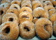  ?? PHOTO BY EMILY RYAN ?? Highland Orchards’ famous apple cider donuts go peachy throughout August.