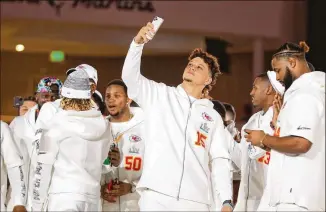  ??  ?? Kansas City Chiefs quarterbac­k Patrick Mahomes shares the stage with teammates during Super Bowl Opening Night in Miami. Teammate Sammy Watkins questioned Mahomes’ dancing skills.