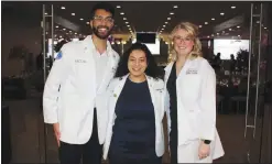  ?? (NWA Democrat-Gazette/Carin Schoppmeye­r) ?? Dhruv Parmar (from left), Klare Emad Aziz, ACHE student doctors; and Allie Wiencek, ACHE Research Institute technical assistant, help welcome guests to the On Call Gala on March 9 in Fort Smith.