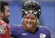  ?? GAIL BURTON - THE ASSOCIATED PRESS ?? In this Aug. 1, 2016, file photo, Baltimore Ravens guard Marshal Yanda, right, talks with quarterbac­k Joe Flacco during practice at the team’s training camp in Baltimore.