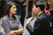  ?? MARK LENNIHAN / AP ?? U.S. Ambassador to the United Nations Nikki Haley talks with Chinese Deputy Ambassador Wu Haitao Friday at U.N. headquarte­rs in New York. Haley thanked China for its support of sanctions against North Korea.