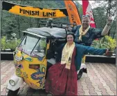  ?? ?? Kirsty and Stewart McConaghy with their tuk-tuk at the finish line of their 3,261km adventure.