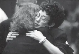  ?? Anacleto Rapping Los Angeles Times ?? SCHAEFFER’S MOTHER, Danna, hugs L.A. County Deputy Dist. Atty. Marcia Clark after stalker Robert Bardo was convicted of Rebecca’s murder Oct. 29, 1991.