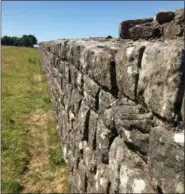  ?? JERRY HARMER — THE ASSOCIATED PRESS ?? In this July 3, 2018 photo, a section of Hadrian’s Wall stretches away towards Birdoswald Fort, in Cumbria, northern England. The wall was built by Roman soldiers, beginning in 122 AD, and ran for 118 kilometers (73 miles), coast to coast. Almost 2,000 years later, it remains a powerful reminder of the majesty of the Roman Empire.