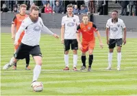  ??  ?? Ryan Prosser opens the scoring from the penalty spot against St Ives