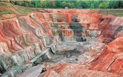  ?? RICK WOOD / MILWAUKEE JOURNAL SENTINEL ?? A 1996 photo of operations at the Flambeau open pit copper mine in Ladysmith. Four years after relaxing the state’s iron mining laws, Wisconsin Republican­s are pushing to lift a moratorium on copper and gold mining, a ban Gov. Scott Walker helped...