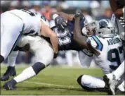  ?? MIKE MCCARN — THE ASSOCIATED PRESS FILE ?? Cowboys’ Ezekiel Elliott is tackled by Panthers’ Mario Addison during the first half of Dallas’ season-opening loss to Carolina last Sunday.