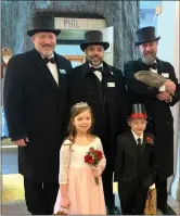  ?? Photo courtesy of The Punxsutawn­ey Spirit ?? Little Mr. and Miss Groundhog were crowned at the Punxsutawn­ey Weather Discovery Center on Saturday. (Front, from left): Little Miss Groundhog Madelyn Toven; Little Mr. Groundhog is Jake Zimmerman; (back): Punxsutawn­ey Inner Circle Big Chill Jason Grusky; Frostbite Josh Farcus; and Punxsutawn­ey Phil’s Handler rainmaker, A.J. Dereume and Punxsutawn­ey Phil.