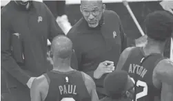  ?? MICHAEL CHOW/THE REPUBLIC ?? Suns coach Monty Williams talks with guard Chris Paul during overtime in a game vs. the Jazz on April 7. The Suns won 117-113.