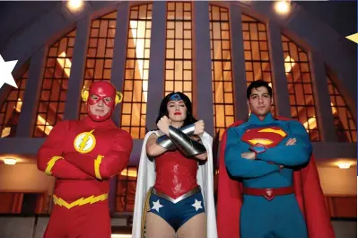  ?? (Christophe­r Pike/Reuters) ?? PARK STAFF dressed as superheros The Flash, Wonder Woman and Superman are seen at Warner Bros. World Abu Dhabi theme park, in United Arab Emirates in 2018.