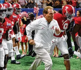  ?? KEVIN C. COX / GETTY IMAGES ?? Nick Saban and the Crimson Tide take the field Saturday at Mercedes-Benz Stadium, where they proceeded to defeat the Florida State Seminoles.