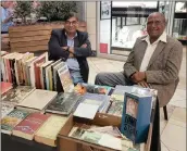  ??  ?? Rare book dealer, Professor Vishnu Padayachee, left, will offer a compliment­ary service appraising books and antiques at The Mahoney Market on Pitlochry Road in Westville this Saturday morning. On the right is 90-year-old book-aholic, Swaminatha­n...