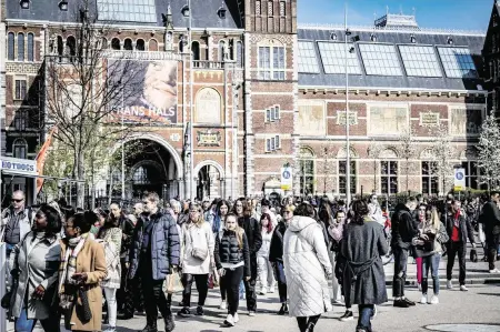  ?? ANP USA TODAY NETWORK ?? Amsterdam tourists crowd the museum square on Easter Sunday. Easter was the start of the tourist season in the capital.