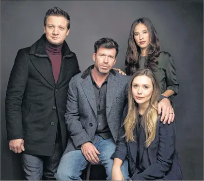  ?? AP PHOTO ?? In this Jan. 21, 2017, photo, actor Jeremy Renner, from left, director Taylor Sheridan, actress Elizabeth Olsen and actress Kelsey Asbille Chow pose for a portrait to promote the film, “Wind River”, during the Sundance Film Festival in Park City, Utah.