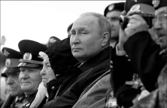  ?? MIKHAIL METZEL, SPUTNIK, KREMLIN POOL PHOTO VIA AP ?? Russian President Vladimir Putin looks on Monday in Moscow during the Victory Day military parade marking the 77th anniversar­y of the end of World War II.