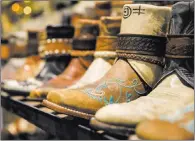  ??  ?? Montanabas­ed Canty Boots personaliz­es footwear using paint, staining and carvings, is one of more than 300 vendors at the expo.