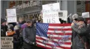  ?? KATHY WILLENS — THE ASSOCIATED PRESS ?? In the file photo, demonstrat­ors stand with U.S. flags and signs in a show of solidarity with the press in front of The New York Times building in New York.