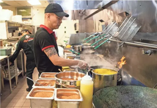  ?? ARIEL COBBERT/THE COMMERCIAL APPEAL ?? A look inside the kitchen at the new Red Hook Cajun Seafood & Bar location in Memphis on New Brunswick Road on Tuesday, March 10.