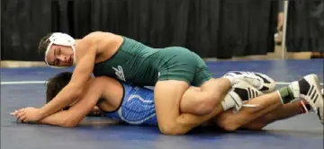  ?? Ken Wunderley/Tri-State Sports & News Service ?? Laurel's Grant MacKay, top, controls Ty Linsenbigl­er of Hempfield en route to a 4-1 semifinal victory in the 152-pound weight class at the Mid-Winter Mayhem tournament Jan. 16. MacKay, who is ranked No. 1 in WPIAL Class 2A by the Post-Gazette, could face Linsenbigl­er, who is ranked No. 3 in Class 3A, in the Powerade tournament.