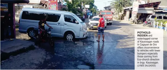  ?? (LYNDE SALGADOS) ?? POTHOLERID­DEN and waterlogge­d corner of Kauswagan roads in Cagayan de Oro offers inconvenie­nce to vehicles with lower bumpers especially those coming from Eco-church direction in brgy. Kauswagan.