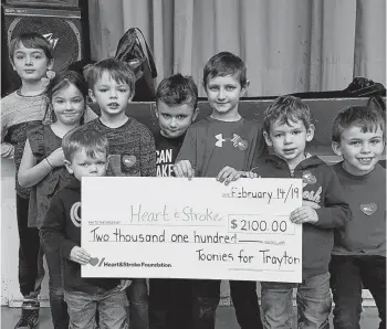  ?? SUBMITTED ?? Students at Belfast Consolidat­ed School raised $2,100 for the Heart and Stroke Foundation of P.E.I. in memory of Trayton Acton, 9, who collapsed from a heart attack at the school in September. From left are Jackson Acton, Harlow Acton, Auston Acton, Griffon Acton (holding the cheque on the left), Neely Bell, Brayden Macpherson, Declan Acton and Ben Docherty. All of the Actons pictured are Trayton’s siblings. Neely and Ben are Trayton’s cousins.