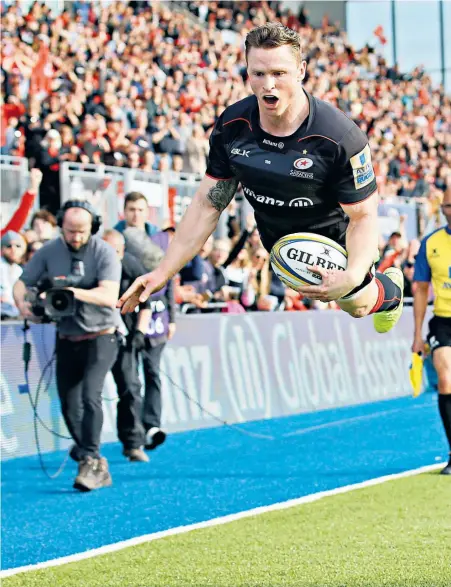  ??  ?? Flying high: Chris Ashton leaps to score a dramatic try for Saracens