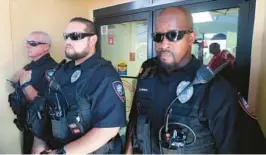  ?? MIKE STOCKER/SOUTH FLORIDA SUN SENTINEL ?? Lauderhill police guard the entrance of the Broward County Supervisor of Elections Office on Nov. 9, 2018, the day then-President Donald Trump first made claims about what was happening with vote counting in Broward County.