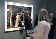  ?? THE CANADIAN PRESS FILES ?? A photo of Queen Elizabeth is viewed as a collection of artwork by famed American photograph­er Annie Leibovitz that was donated to the Art Gallery of Nova Scotia, in Halifax, in 2013. A federal board has rejected the Art Gallery of Nova Scotia’s...