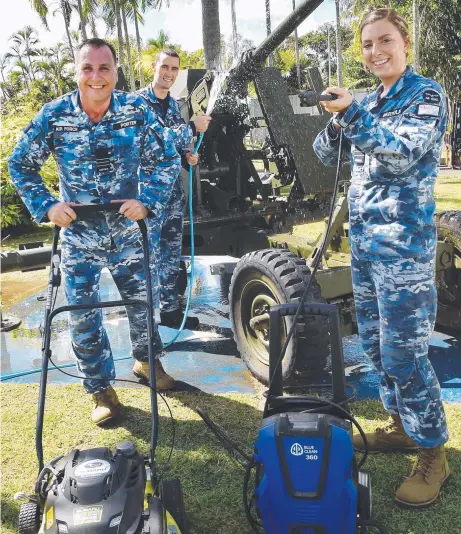  ?? Picture: KATRINA BRIDGEFORD ?? Squadron Leader Paul Scott, Wing Commander Darryl Porter (back) and Flight Lieutenant Nikolina Bartolic pitch in to help clean up at Darwin North RSL ahead of Anzac Day