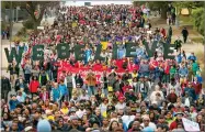  ?? AP PHOTO BY RALPH BARRERA ?? Hundreds celebratin­g Martin Luther King Jr. Day march east on a street from the Texas state Capitol to the campus of Huston-tillotson University in Austin, Texas, to remember the civil rights activist on Monday.