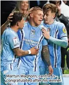  ?? ?? Martyn Waghorn, centre, is congratula­ted after his winner