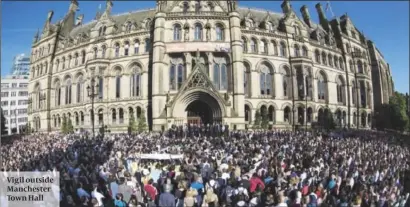  ?? PHOTO: PA ?? Vigil outside Manchester Town Hall