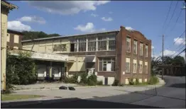  ?? Photos by Joseph B. Nadeau ?? The city began demolishin­g sections of the former Dorado Mill Complex at 719 River St. last week.