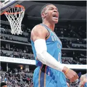  ?? PHOTO] [AP ?? Oklahoma City Thunder guard Russell Westbrook yells to the bench after driving the lane for a basket Thursday against the Denver Nuggets. The Nuggets won, 102-94.