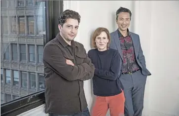  ?? Michael Nagle For The Times ?? FILMMAKER KELLY REICHARDT flanked by her “First Cow” costars John Magaro, left, and Orion Lee.