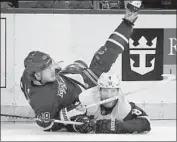  ?? Bruce Bennett Getty Images ?? DETROIT’S Justin Abdelkader (8) levels New York’s Brendan Lemieux and receives a roughing penalty.