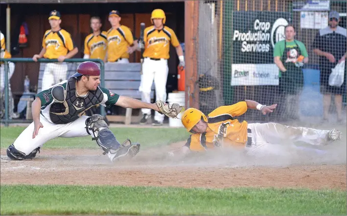  ?? STEVEN MAH/SOUTHWEST BOOSTER ?? Swift Current 57’s catcher Spencer Rankin (left) tried to get the tag down on Moose Jaw’s Scott Platt at home during a close loss at Mitchell Field last week.