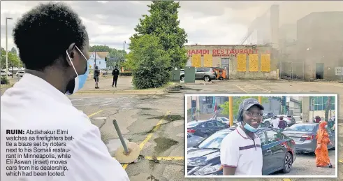  ??  ?? RUIN: Abdishakur Elmi watches as firefighte­rs battle a blaze set by rioters next to his Somali restaurant in Minneapoli­s, while Eli Aswan (inset) moves cars from his dealership, which had been looted.
