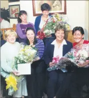  ?? ?? Presentati­ons were made to three of the staff of Fermoy Community Hospital in September 2001, who were due to be married soon after - Margaret Kerins makes a presentati­on of a bouquet of flowers to Sinead Browne, while Vera Noonan makes a presentati­on to Joyce Kingston and at the back, Margaret Dennehy makes a presentati­on to Emma Spiers.