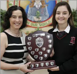  ??  ?? Principal Emma Raughter presents the award for Cultural Student of the Year to Emily Lannin.