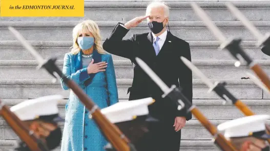  ?? J. SCOTT APPLEWHITE / AP PHOTO ?? President Joe Biden and his wife, Dr. Jill Biden, watch a military pass-in-review ceremony at the U.S. Capitol during inaugurati­on ceremonies on Wednesday.