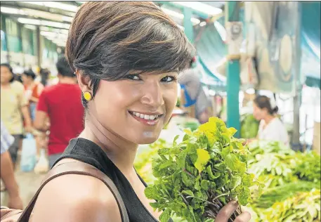  ??  ?? ALL SMILES: Kamini Pather, who won ‘SA Masterchef’ in its second season, takes food lovers to 10 different cities around the world in her new television series