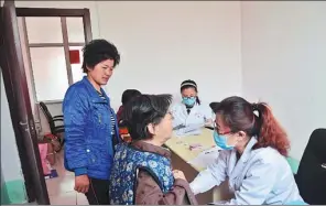  ?? ZHAO YUGUO / FOR CHINA DAILY ?? Villagers undergo checks for cervical and breast cancer at the family planning office in Liaocheng city, Shandong province.