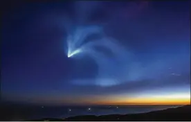  ?? DAVID MCNEW / GETTY IMAGES ?? The SpaceX Falcon 9 rocket curves into space Sunday after launching from Vandenberg Air Force Base carrying SAOCOM 1A and ITASAT 1 satellites near Santa Barbara, California. Many were taken by surprise when the launch lit the sky.